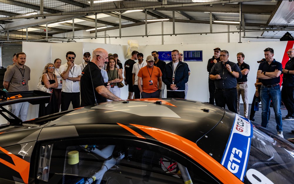 Guests meeting the team in the garage